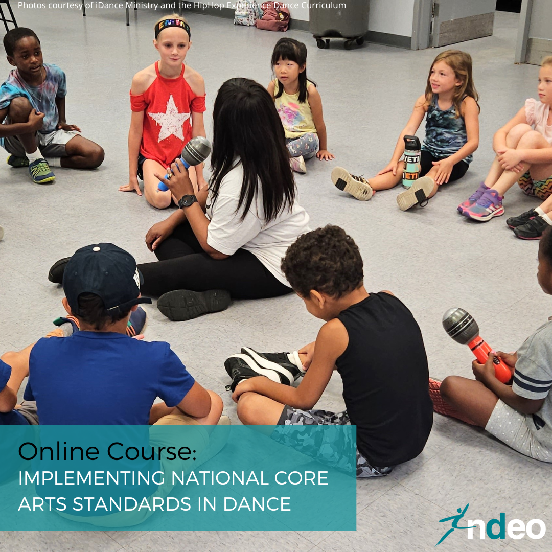 Young students sit in a circle around a teacher. Text on the image says "Online Course: Implementing the National Core Are Standards in Dance"